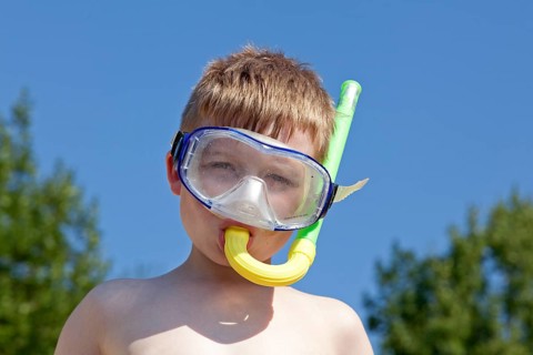 Boy with diving mask and snorkel