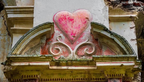 Heart carved in a wall in the ruins of a church