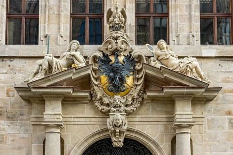 Crest with eagle and allegorical figures