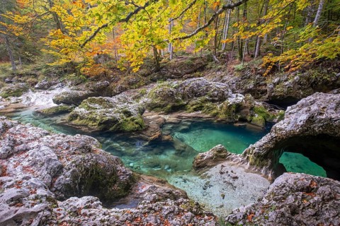 Bizarre rock formations at the mountain stream Mostnica in autumn