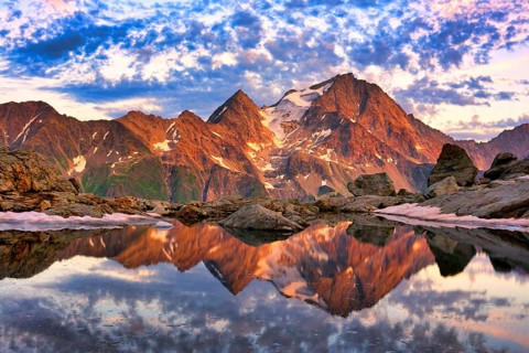 Reflection of the Oberalpstock in a mountain lake