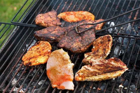 Heavily roasted meat on a charcoal grill