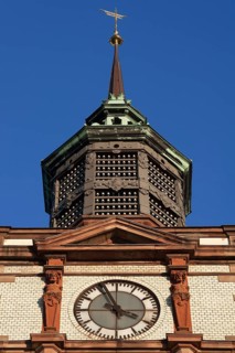 Clock tower with insulators of former telegraph poles