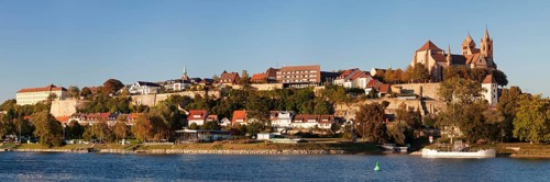 View across river Rhine to the Munsterberg hill with St. Stephansmunster cathedral