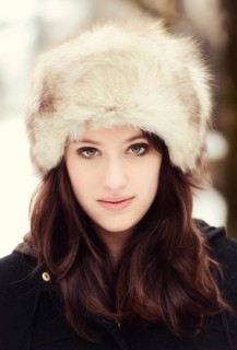 Young woman wearing a fur hat in winter