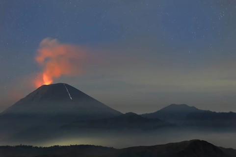 Active Gunung Bromo volcano at night