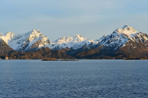 Snow-covered mountains on Hadselfjord in the evening light