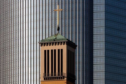 Steeple of the Church of Matthew in front of the Pollux building in Frankfurt am Main