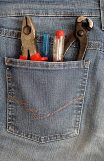 Pliers and screwdrivers in a back pocket