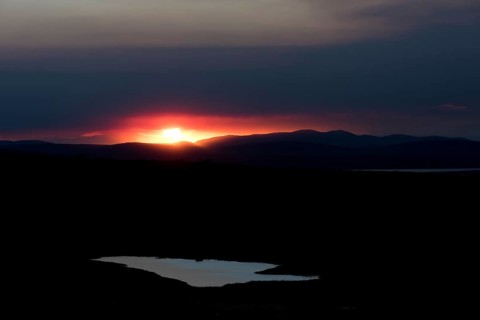 Sunset behind the ash and gas cloud of the Holuhraun fissure eruption