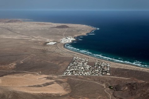 View from the Ermita de las Nieves on the Risco de Famara on the beach Playa de Famara