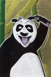 Laughing panda with spray can in hand