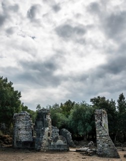Ruins of the church of Santa Maria di Riscamone against a dramatic sky