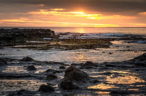 Landscape with sunset on the rocky coast