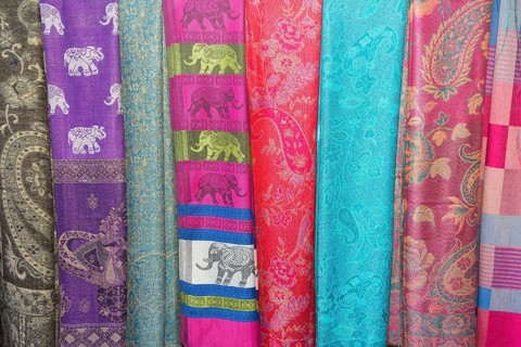 Various colorful scarves at a market