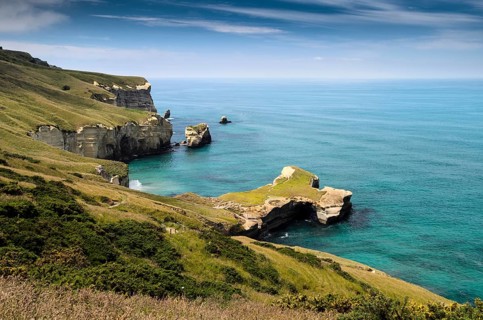 Rocky cliffs on the Pacific coast at Tunnel Beach