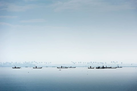 Cockle pickers with their boats