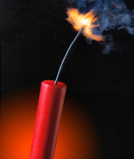 Stick of dynamite with the fuse burning