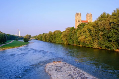 Isar with green areas and Maximilianskirche in Isarvorstadt