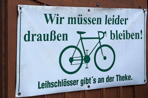 Sign for cyclists at a garden restaurant