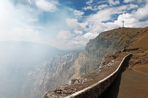 Smoking crater rim with the Bobadilla Cross