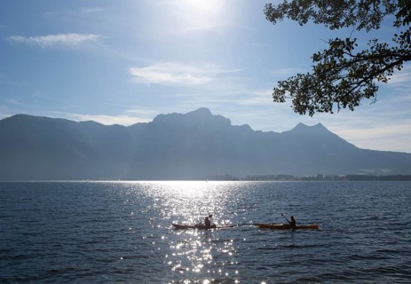 Canoeists on Lake Mondsee with Drachenwand and Schober