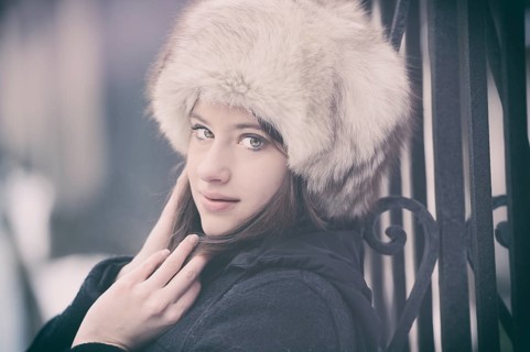 Young woman wearing a fur hat