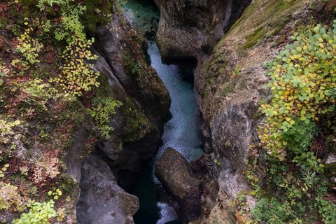 Mountain stream flows through a narrow gorge