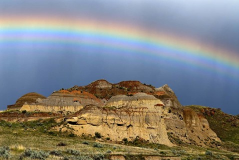 Rainbow over colorful badlands