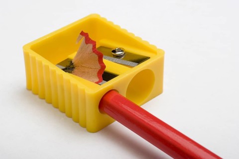 Red pencil and yellow pencil sharpener
