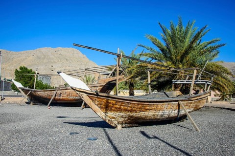 Old dhows in front of Khasab fort