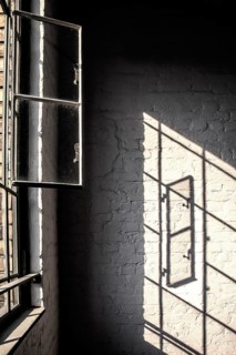 Light reflection of a window in the stairwell of a renovated factory