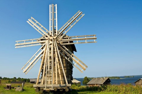 Old wooden windmill and houses