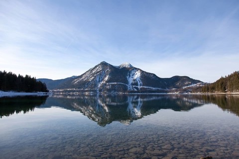 Walchensee or Lake Walchen and Herzogstand mountain in winter