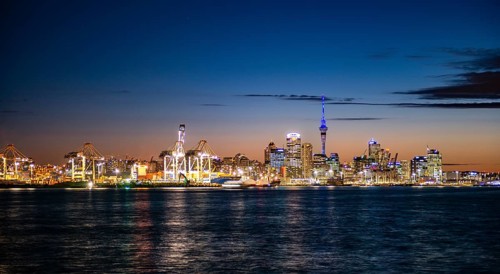 Illuminated skyline of Auckland at sunset