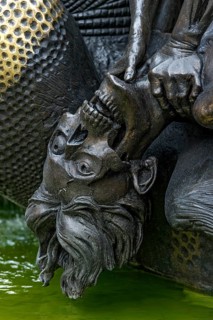 Half-decayed husband fighting with wife statue
