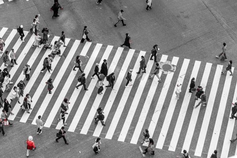 Single red person crosses