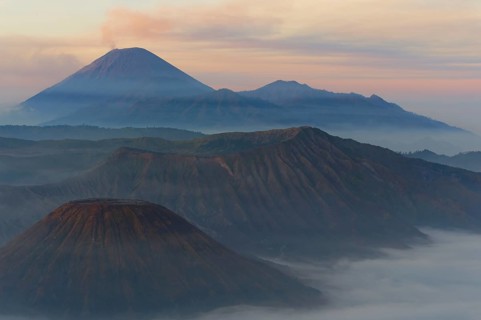 Sunrise over the smoking Gunung Bromo volcano