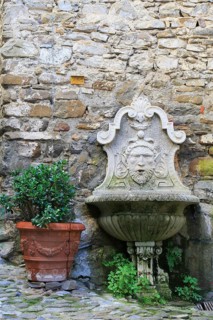 Fountain and a terracotta flower pot