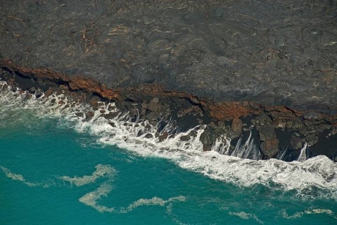 Surf at the foot of Mt Kilauea