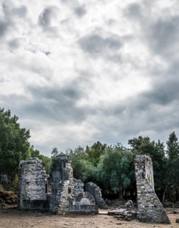 Ruins of the church of Santa Maria di Riscamone against a dramatic sky