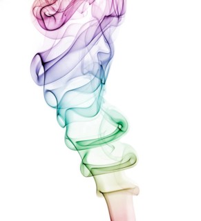 Colourful smoke from an incense stick or joss stick