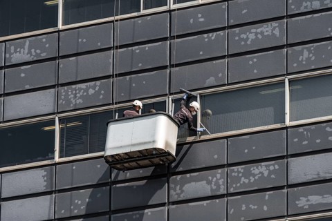 Two window cleaners at a skyscraper