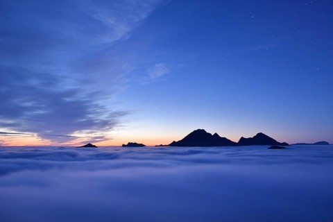 Clouds and mountain peaks
