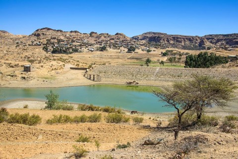 Mountain landscape along the road from Asmarra to Qohaito with a little pond