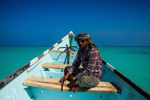 Socotran man sitting in fishing boat