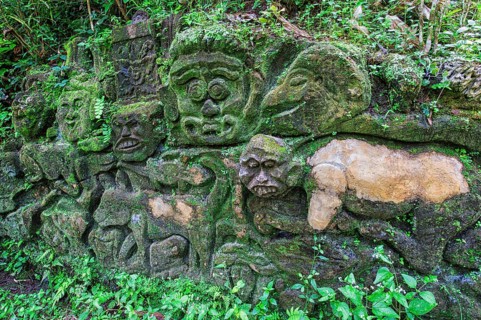 Moss-covered sculpture in the forest