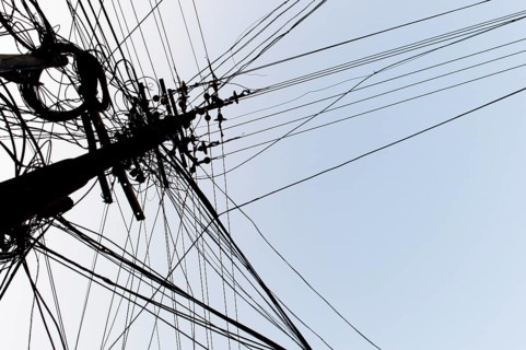 Tangled power cables on a power pole