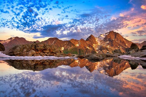 Reflection of the Oberalpstock in a mountain lake
