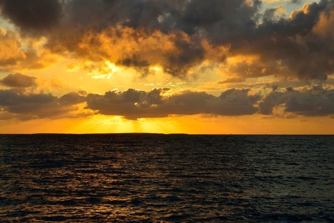 Sunset at sea with clouds